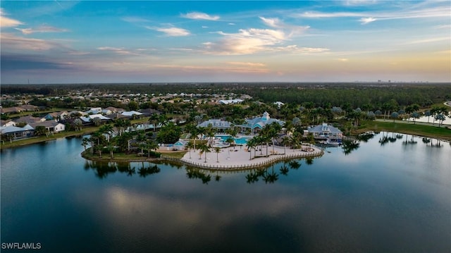 aerial view at dusk with a water view