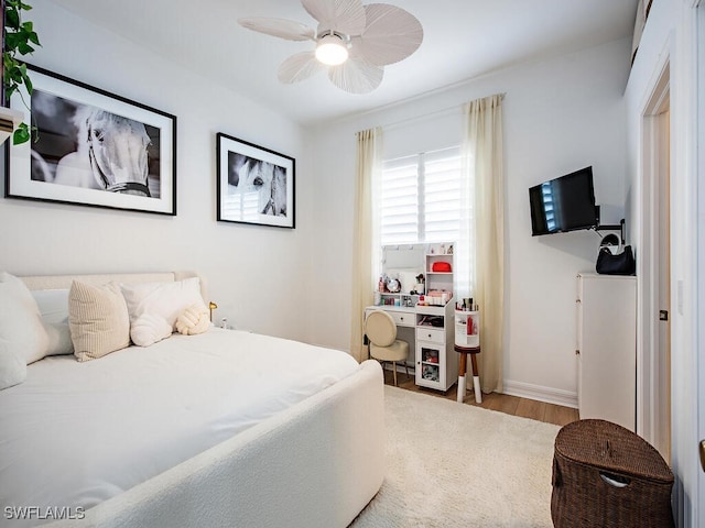 bedroom featuring ceiling fan and wood-type flooring