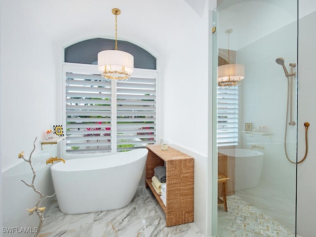 bathroom with plus walk in shower and a notable chandelier