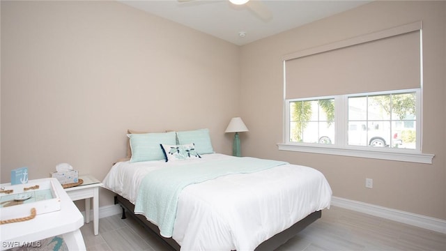 bedroom featuring a ceiling fan and baseboards