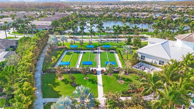 birds eye view of property with a residential view and a water view