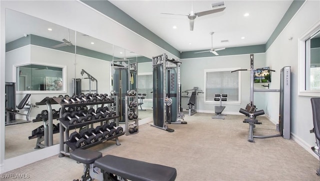 gym featuring visible vents, carpet flooring, a ceiling fan, and baseboards