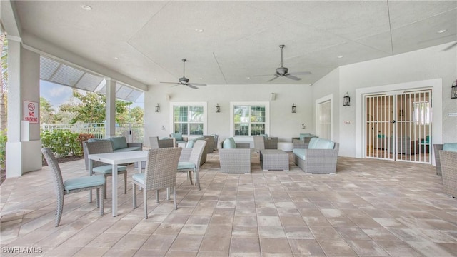 sunroom / solarium with ceiling fan