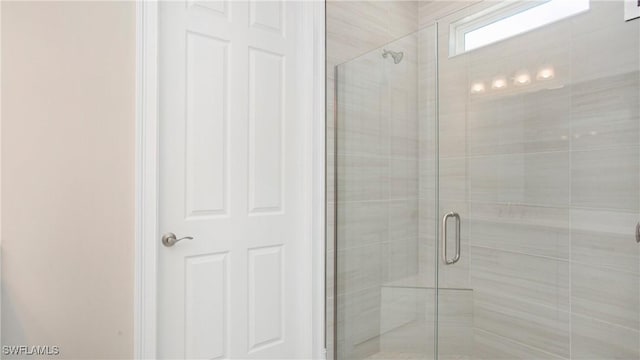 bathroom featuring a shower stall