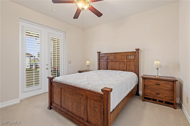 bedroom with access to outside, light colored carpet, and ceiling fan