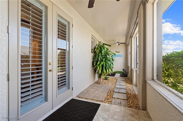 view of exterior entry with ceiling fan