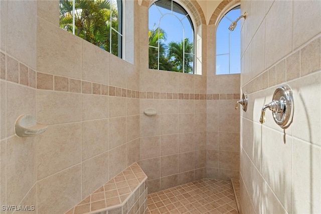 bathroom with tiled shower