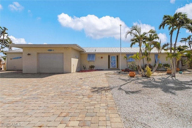 single story home with a garage