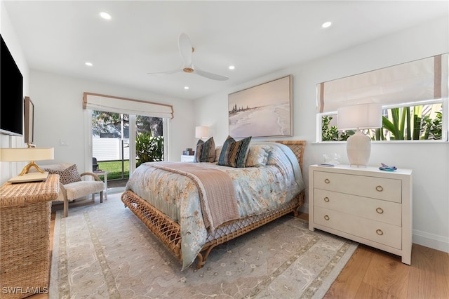 bedroom featuring ceiling fan, access to exterior, and light hardwood / wood-style flooring