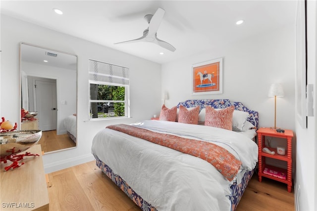 bedroom featuring ceiling fan and hardwood / wood-style floors