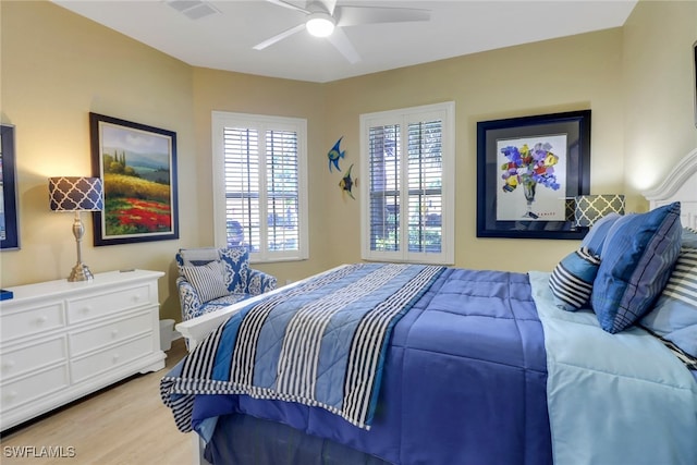 bedroom featuring ceiling fan and light hardwood / wood-style flooring