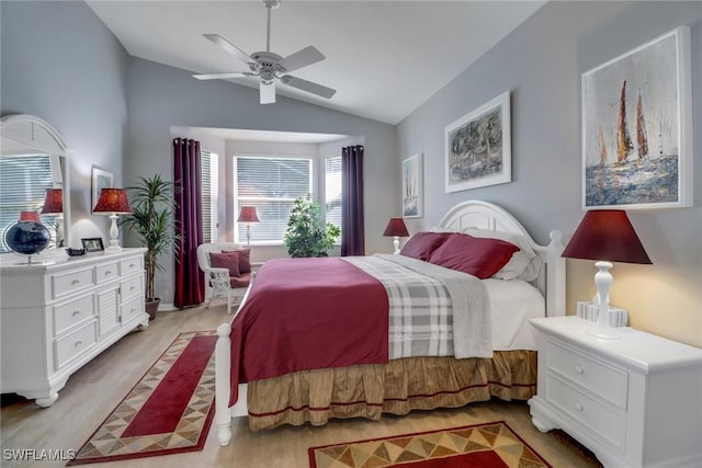 bedroom with vaulted ceiling, ceiling fan, and light wood-type flooring