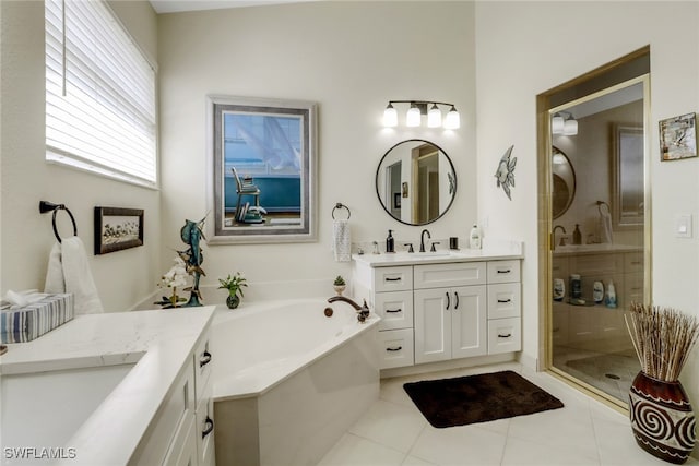 bathroom with vanity, separate shower and tub, and tile patterned floors