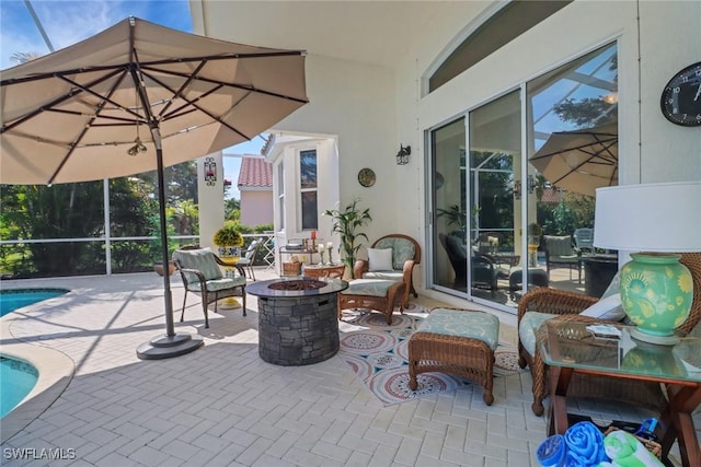 view of patio featuring an outdoor fire pit