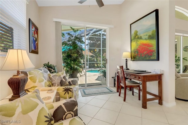 interior space with ceiling fan and light tile patterned flooring