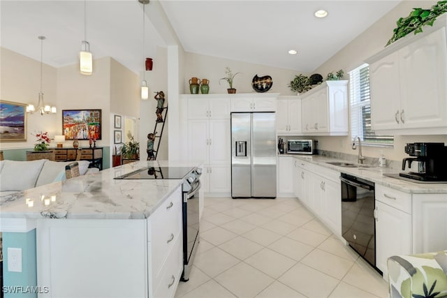 kitchen with pendant lighting, sink, white cabinetry, stainless steel appliances, and a kitchen island