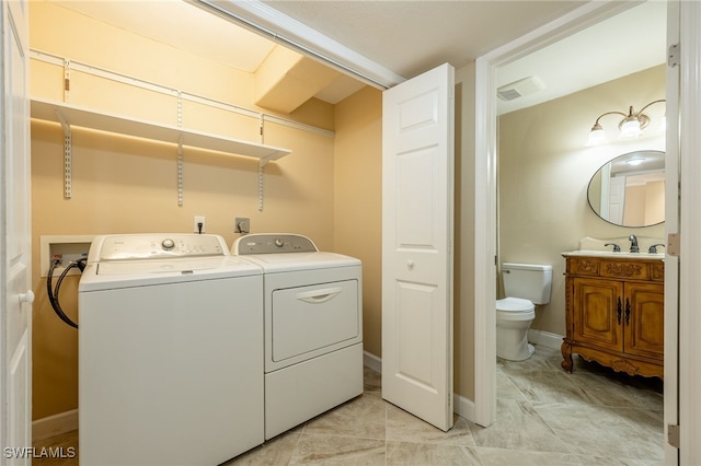 3458 Hancock Bridge Pkwy Unit 114, North Fort Myers, FL 33903 - laundry room with washer and clothes dryer and baseboards