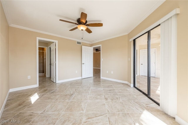 3458 Hancock Bridge Pkwy Unit 114, North Fort Myers, FL 33903 - unfurnished bedroom featuring crown molding, a closet, baseboards, connected bathroom, and ceiling fan