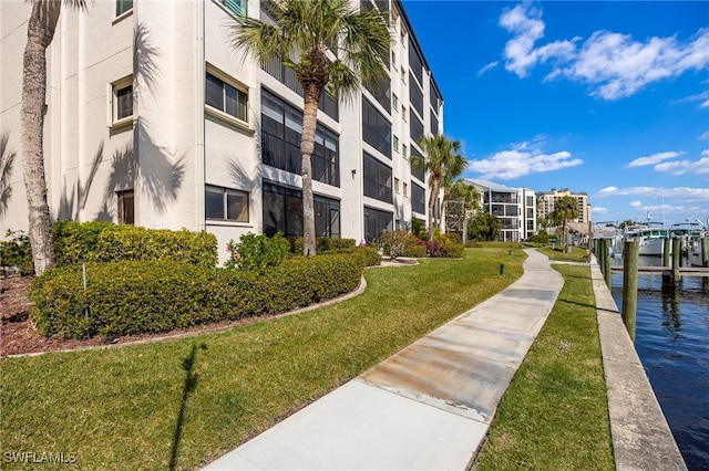 3458 Hancock Bridge Pkwy Unit 114, North Fort Myers, FL 33903 - view of apartment building / complex featuring a water view and boat lift