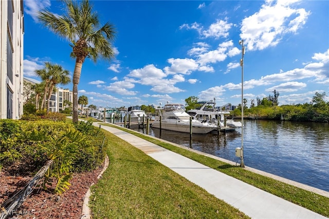 3458 Hancock Bridge Pkwy Unit 114, North Fort Myers, FL 33903 - dock area featuring boat lift, a water view, and a yard