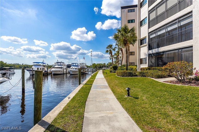 3458 Hancock Bridge Pkwy Unit 114, North Fort Myers, FL 33903 - dock area featuring a water view and a yard
