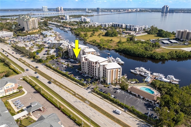 3458 Hancock Bridge Pkwy Unit 114, North Fort Myers, FL 33903 - drone / aerial view of a large body of water, a notable bridge, apartment complex / building, and a highway