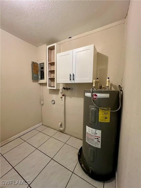 utility room featuring electric panel and water heater