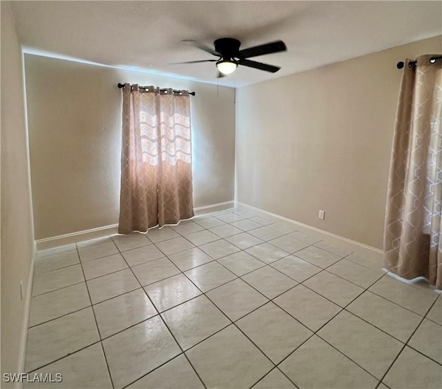 unfurnished room featuring light tile patterned floors and ceiling fan