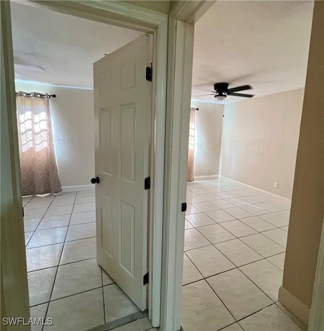 hallway featuring light tile patterned floors