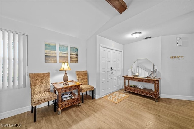 sitting room with hardwood / wood-style flooring