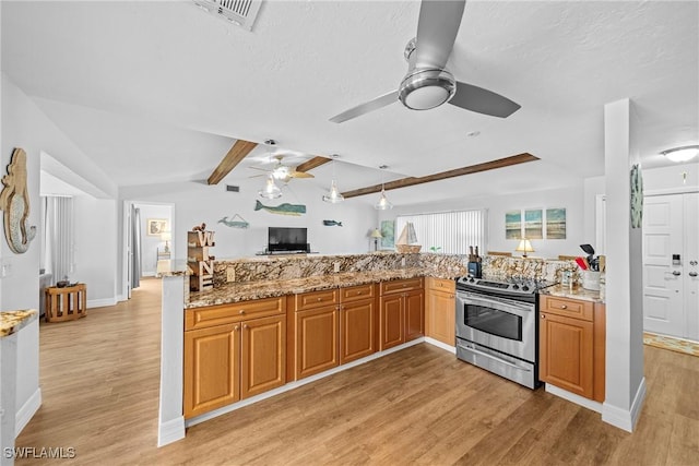 kitchen featuring light hardwood / wood-style floors, kitchen peninsula, light stone counters, and stainless steel electric range