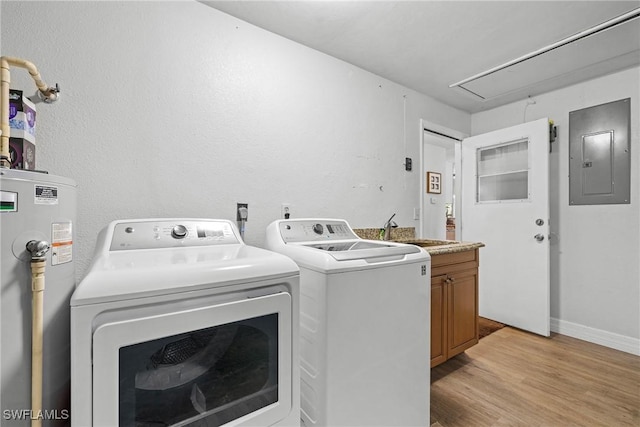 washroom featuring sink, cabinets, washer and dryer, electric panel, and electric water heater