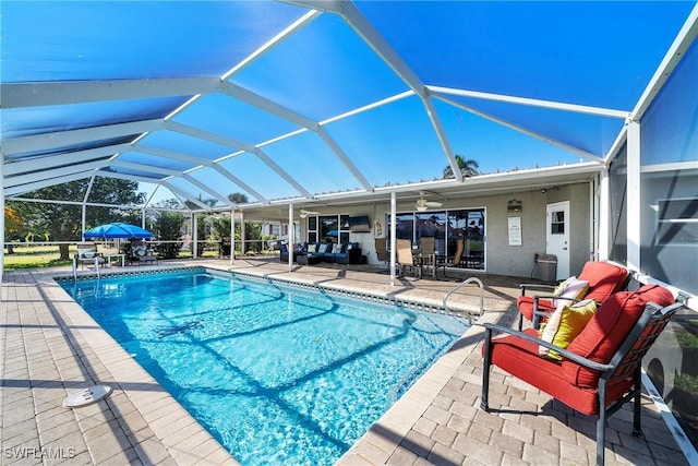 view of pool featuring a lanai and a patio area