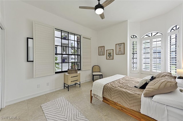 tiled bedroom with ceiling fan