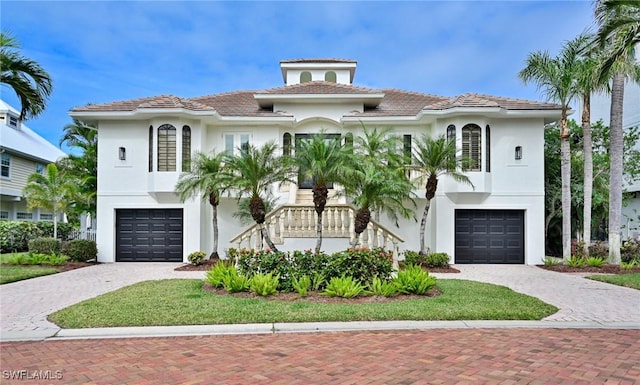 mediterranean / spanish house with a garage