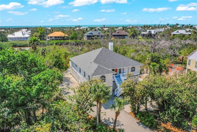 birds eye view of property with a residential view