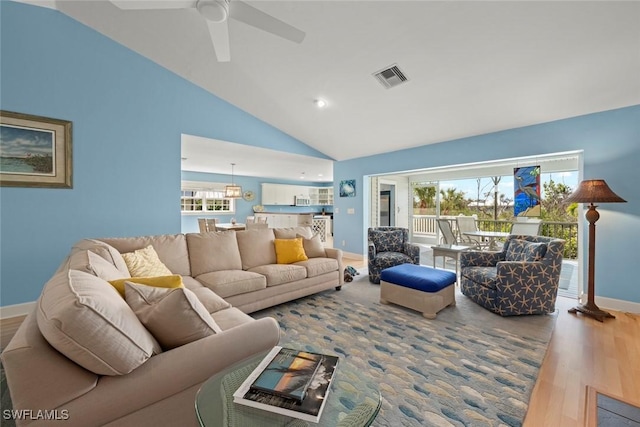 living room featuring visible vents, ceiling fan, wood finished floors, high vaulted ceiling, and baseboards