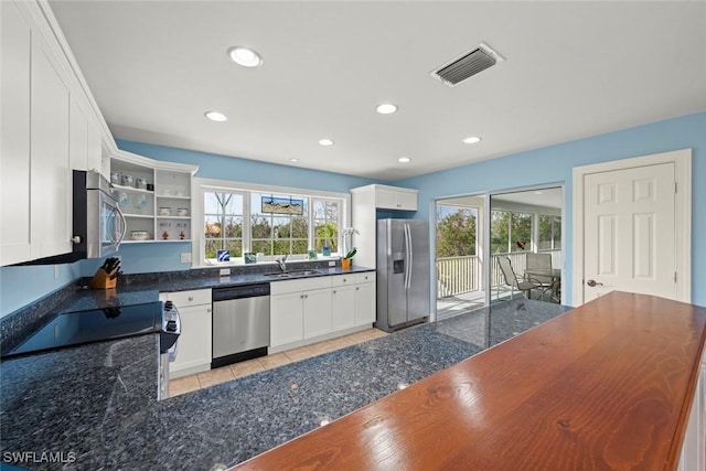 kitchen featuring a sink, visible vents, white cabinetry, appliances with stainless steel finishes, and open shelves