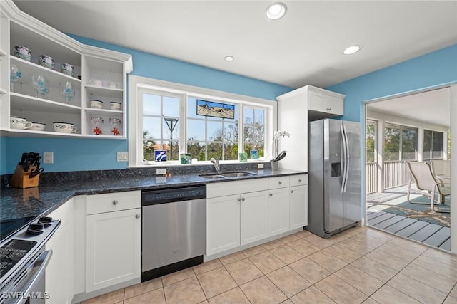 kitchen with white cabinets, appliances with stainless steel finishes, open shelves, a sink, and recessed lighting