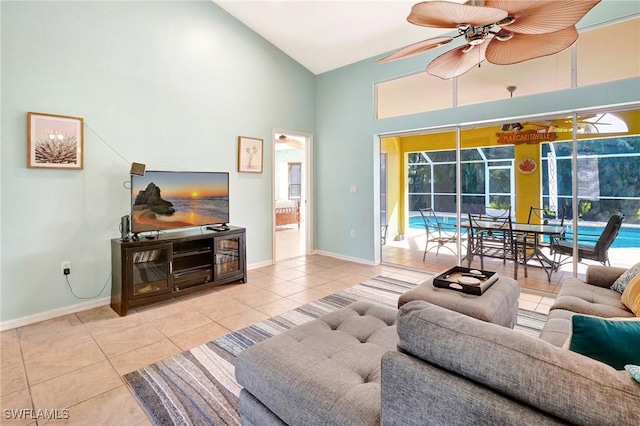 tiled living room featuring high vaulted ceiling, baseboards, a sunroom, and ceiling fan