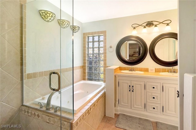 full bathroom featuring tile patterned floors, a sink, a jetted tub, double vanity, and lofted ceiling