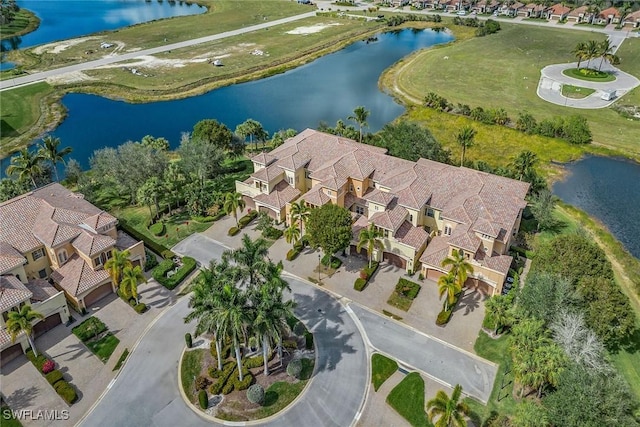 drone / aerial view with a water view