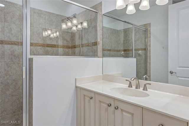 bathroom with vanity and an enclosed shower