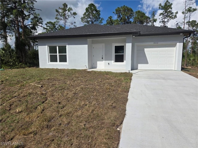 ranch-style home with a garage, concrete driveway, roof with shingles, a front lawn, and stucco siding