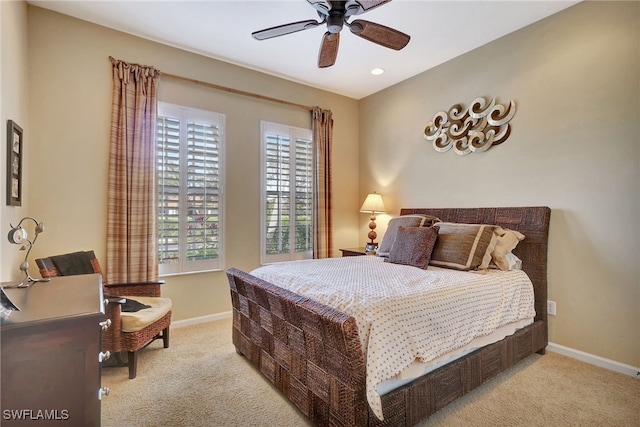 carpeted bedroom featuring ceiling fan