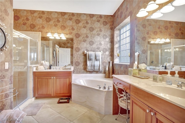 bathroom with tile patterned flooring, shower with separate bathtub, and vanity