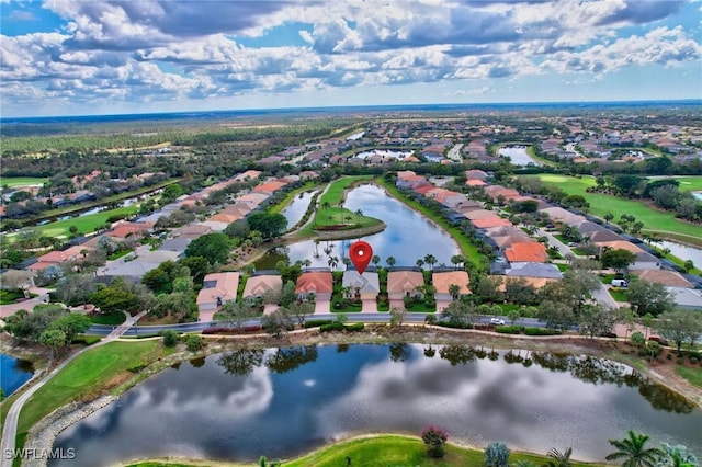 birds eye view of property with a water view