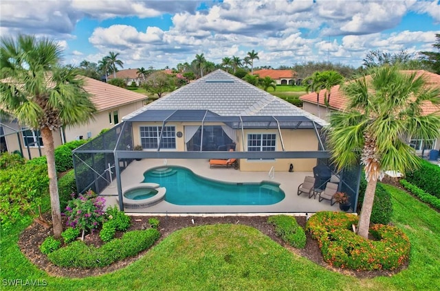 view of pool featuring a patio, a lanai, and an in ground hot tub