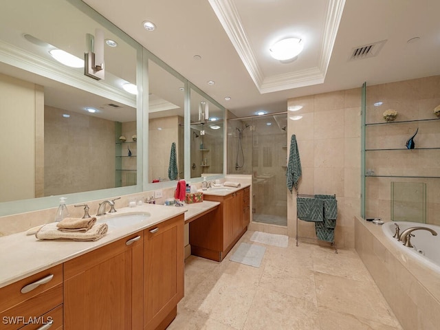 bathroom with crown molding, vanity, a tray ceiling, and plus walk in shower