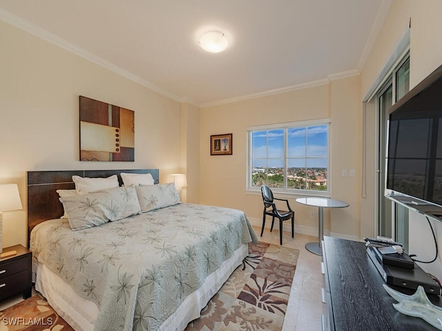 bedroom with crown molding and light hardwood / wood-style floors